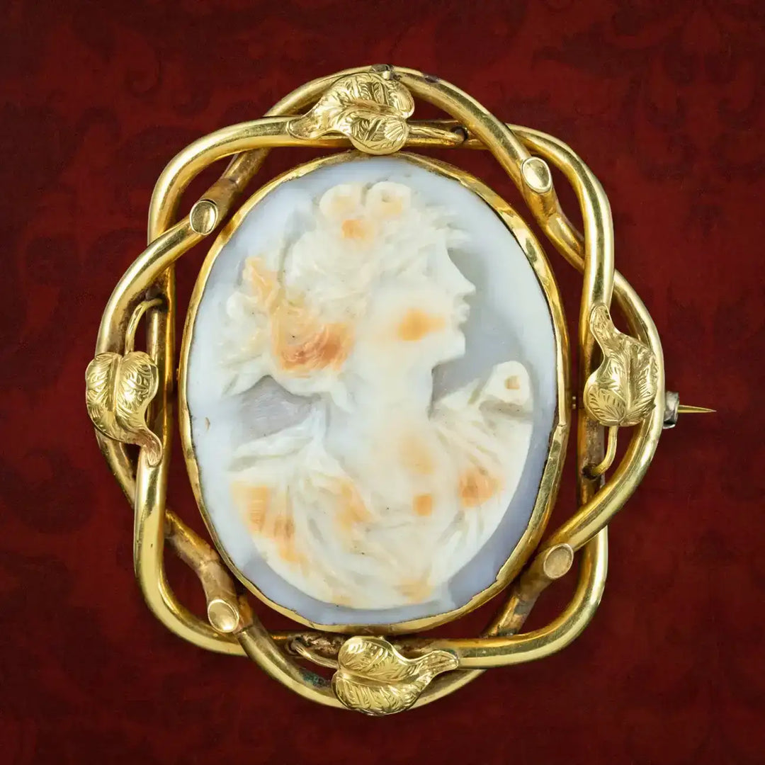 A modern Sheffield 9ct gold mounted oval hand carved cameo shell portrait brooch/pendant in scroi